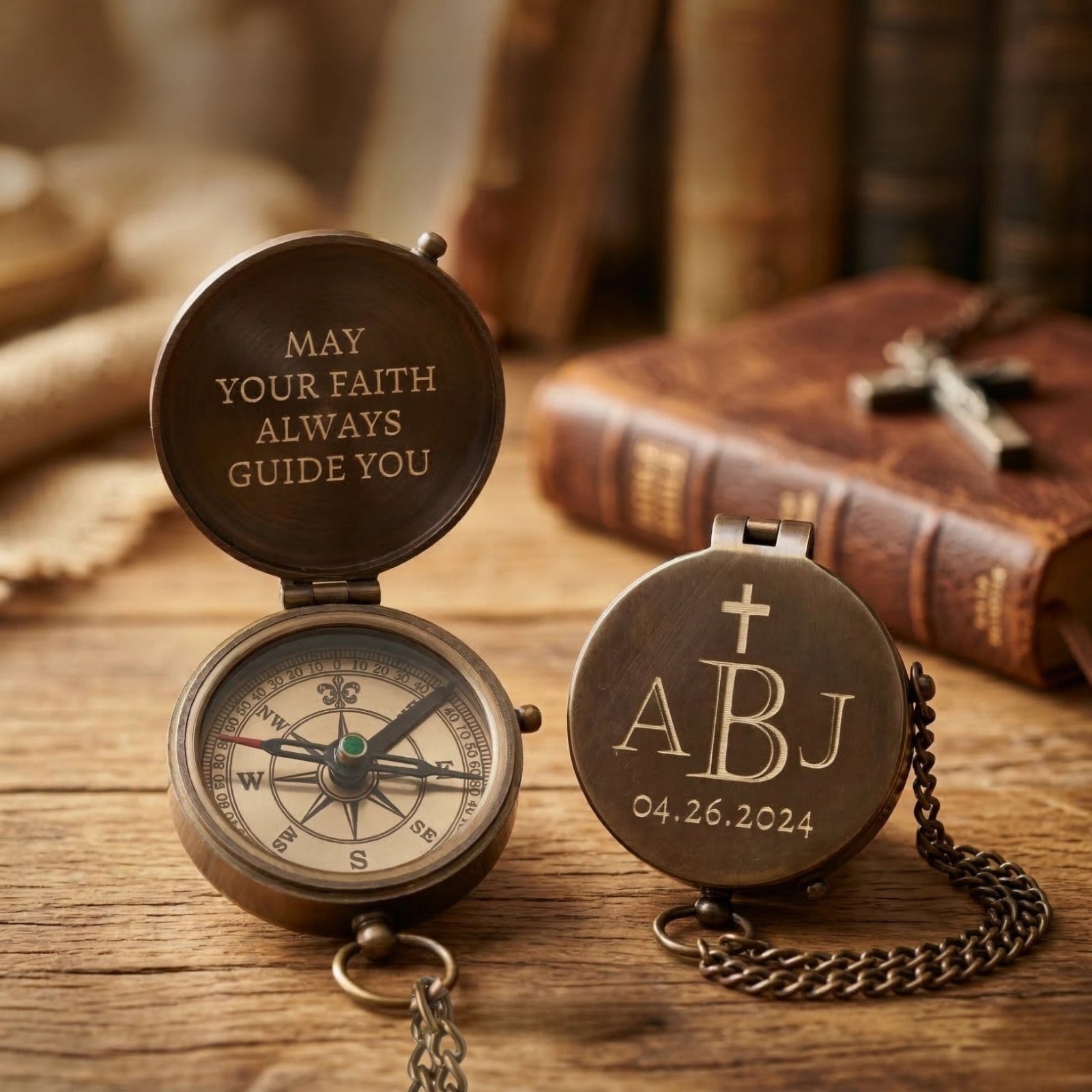 Personalized compass with engraved message and initials on a wooden surface with books in the background.