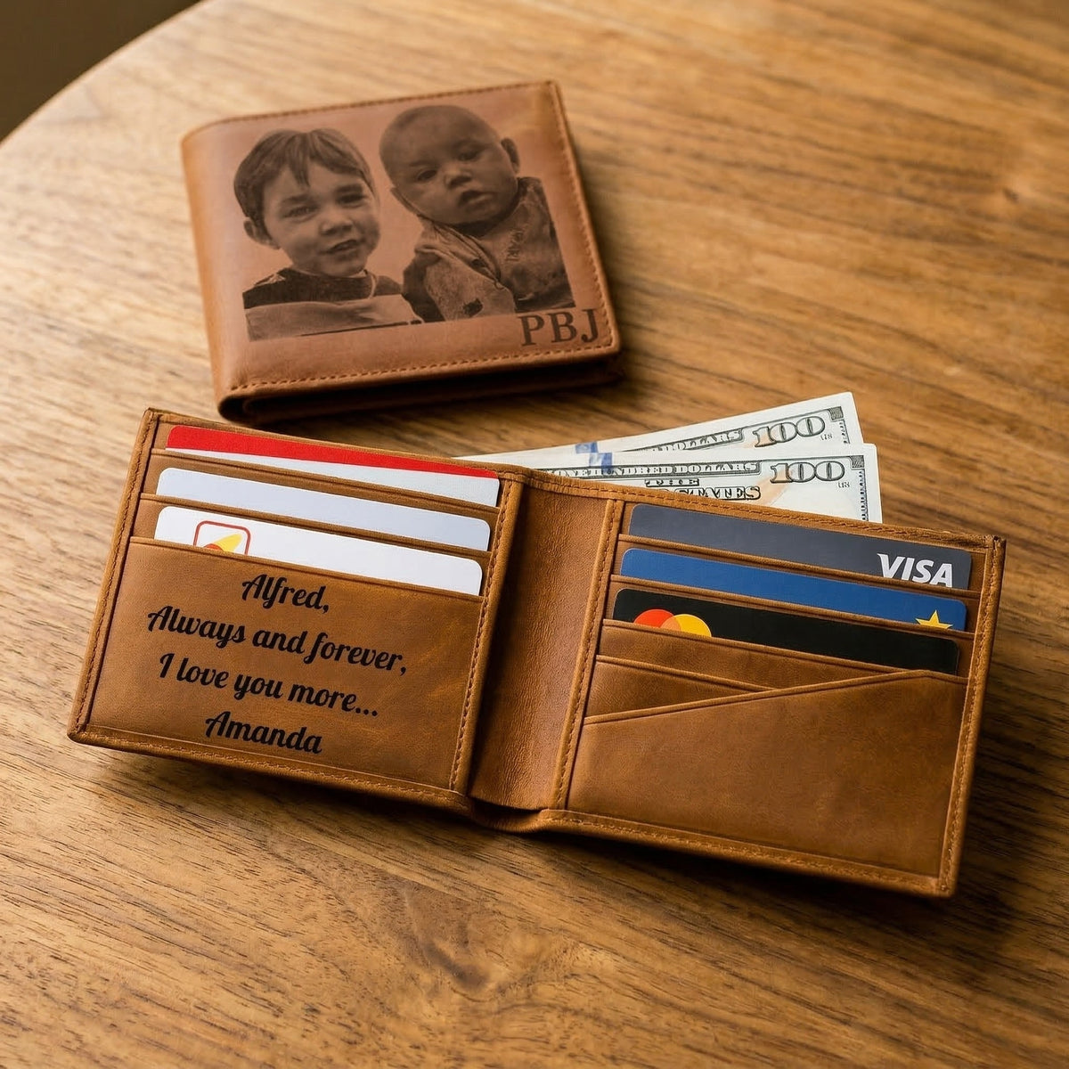 Personalized compass with engraved message and leather case on a wooden surface