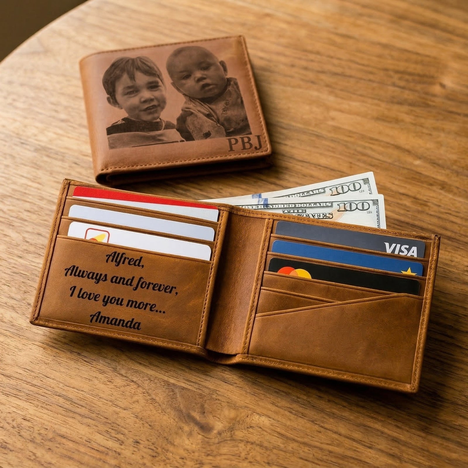 Personalized compass with engraved message and leather case on a wooden surface