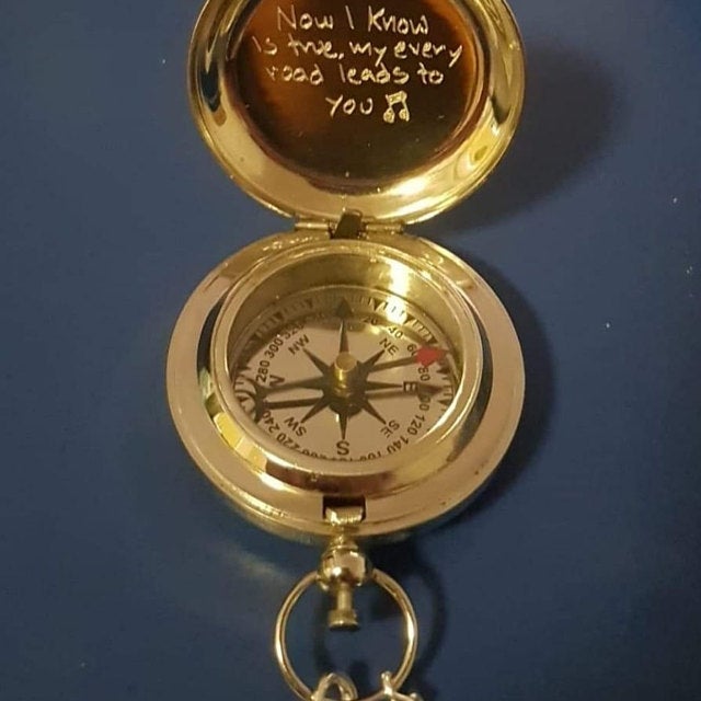 engraved brass compass