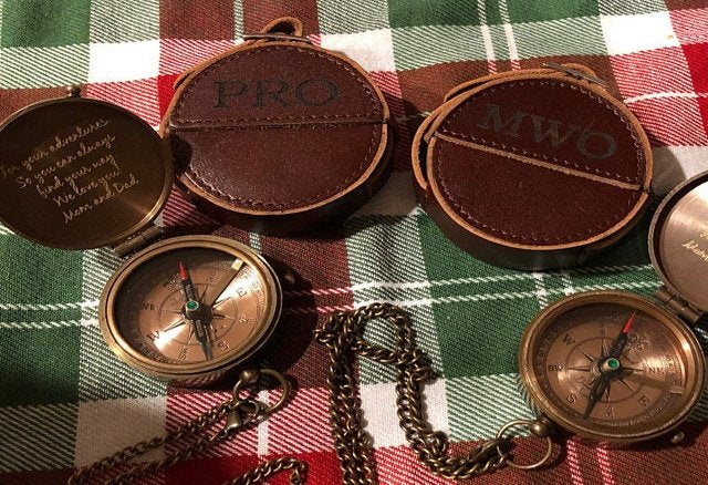 engraved compass with leather pouch