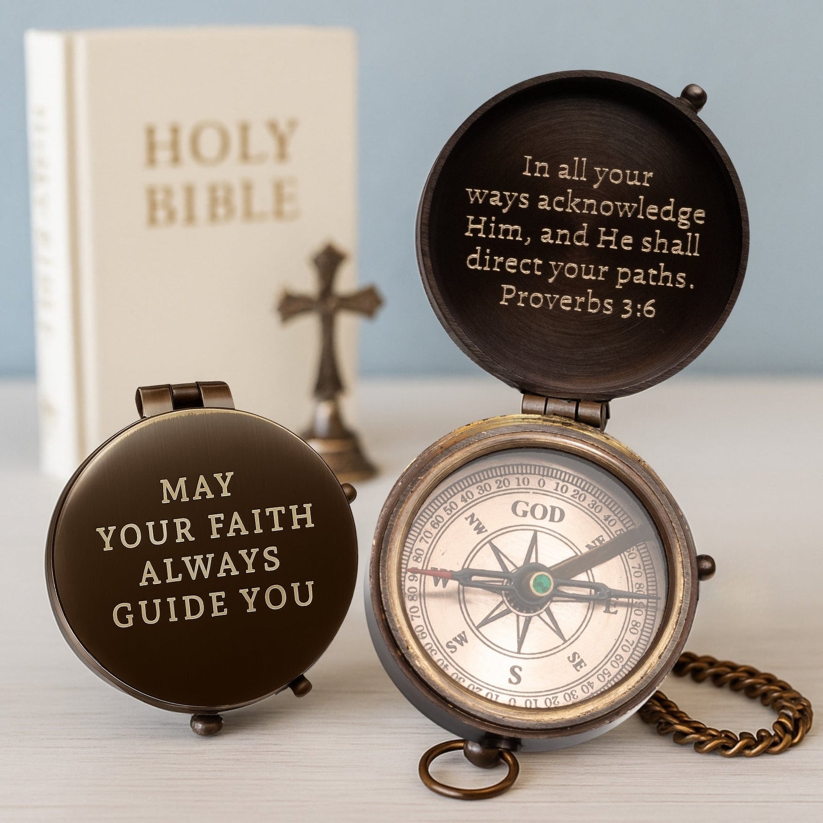 Decorative compass with inspirational text on a light background