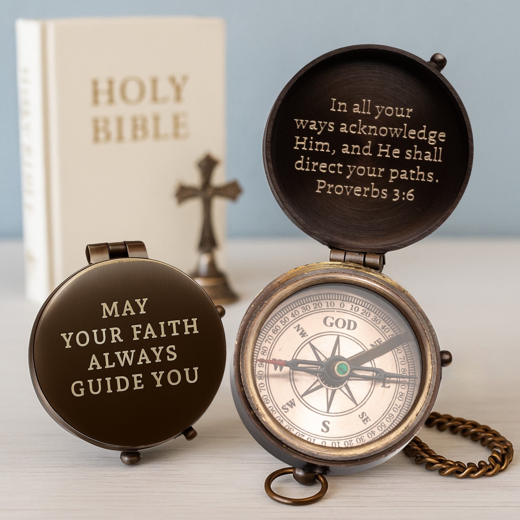Decorative compass with inspirational text on a light background
