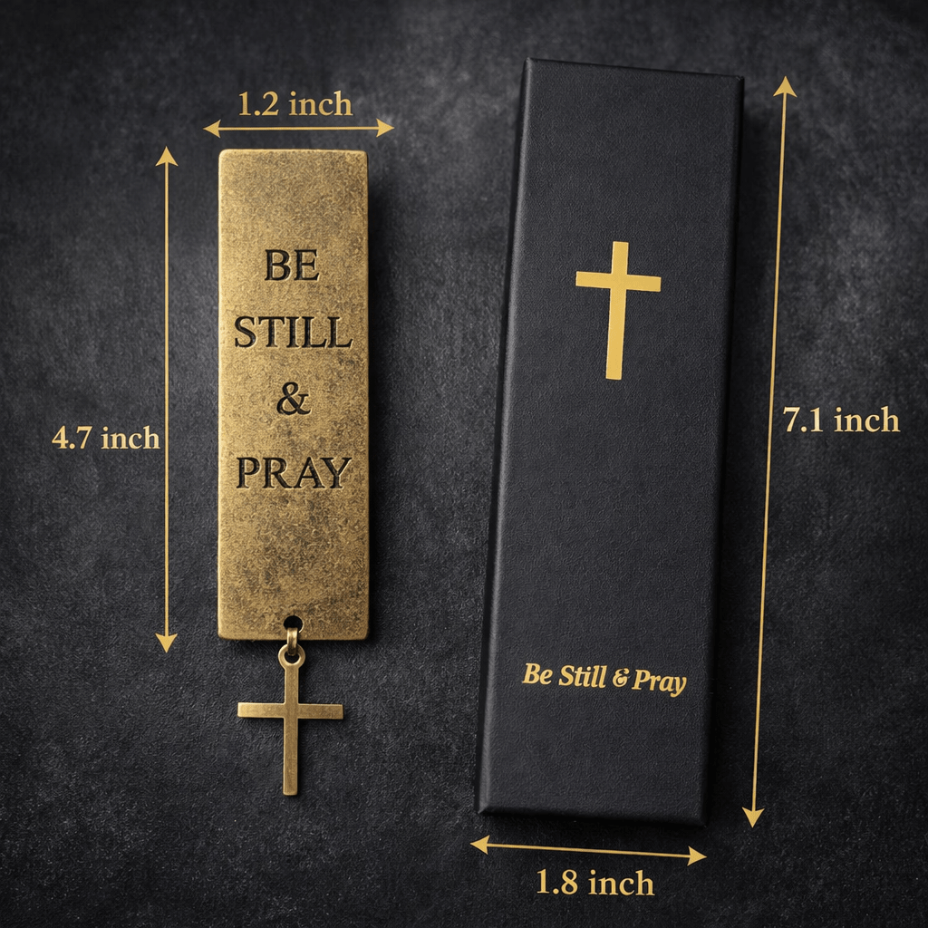 Gold 'Be Still &amp; Pray' pendant with dimensions and packaging on a dark background