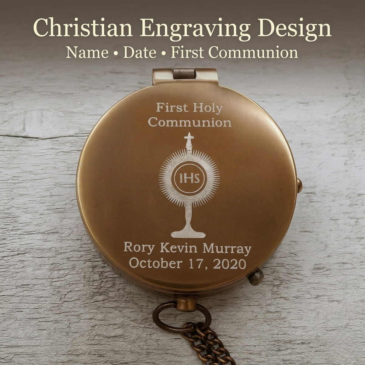 Personalized first holy communion compact mirror with engraved design on a wooden surface