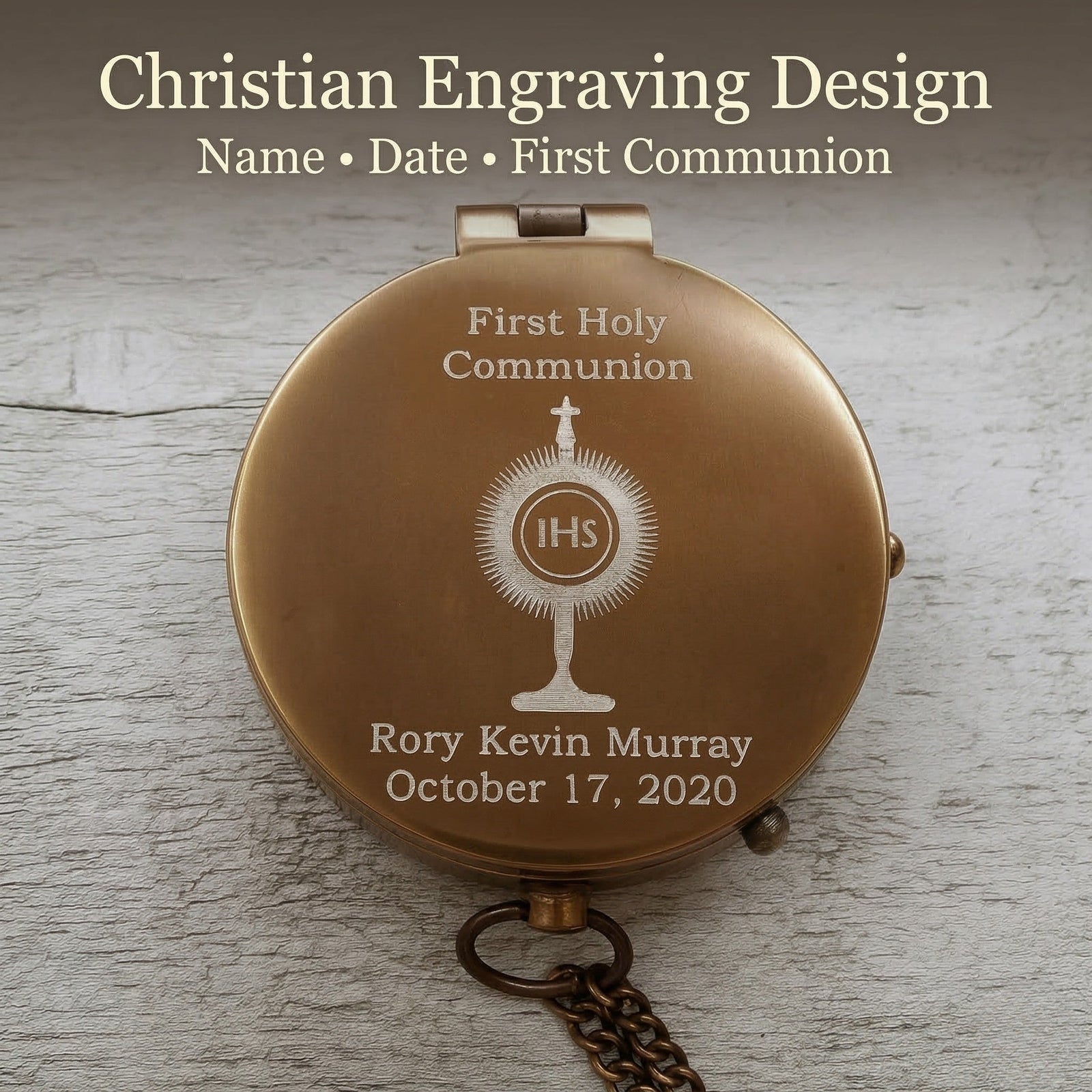 Personalized first holy communion compact mirror with engraved design on a wooden surface