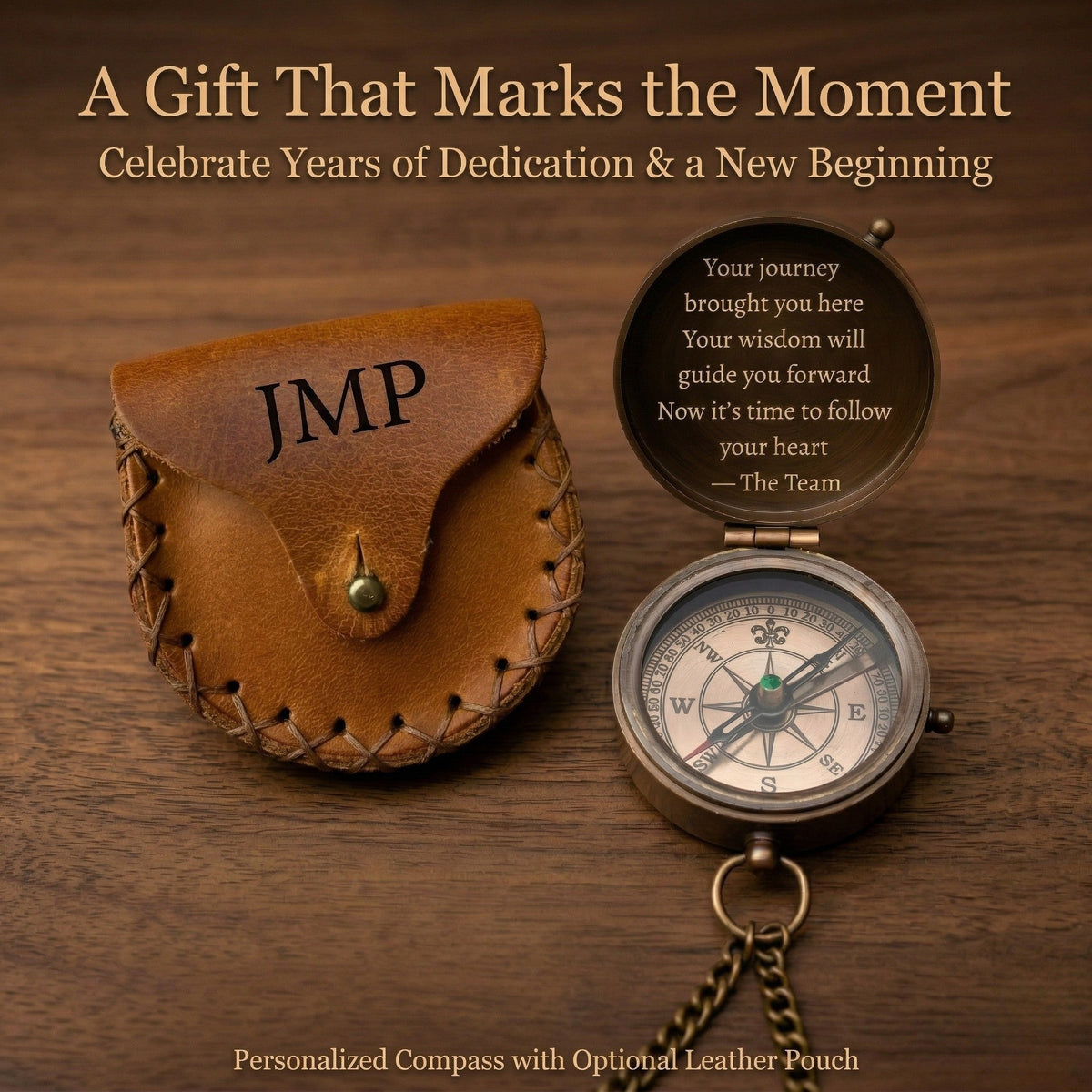 Personalized compass with leather pouch on a wooden surface, featuring text and branding.