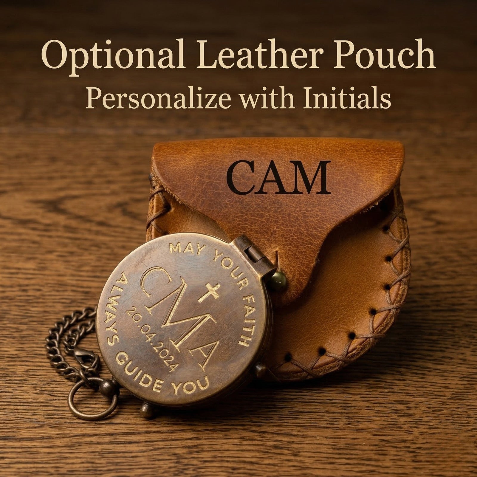 Brown leather pouch with 'CAM' initials and a bronze pendant on a wooden surface.