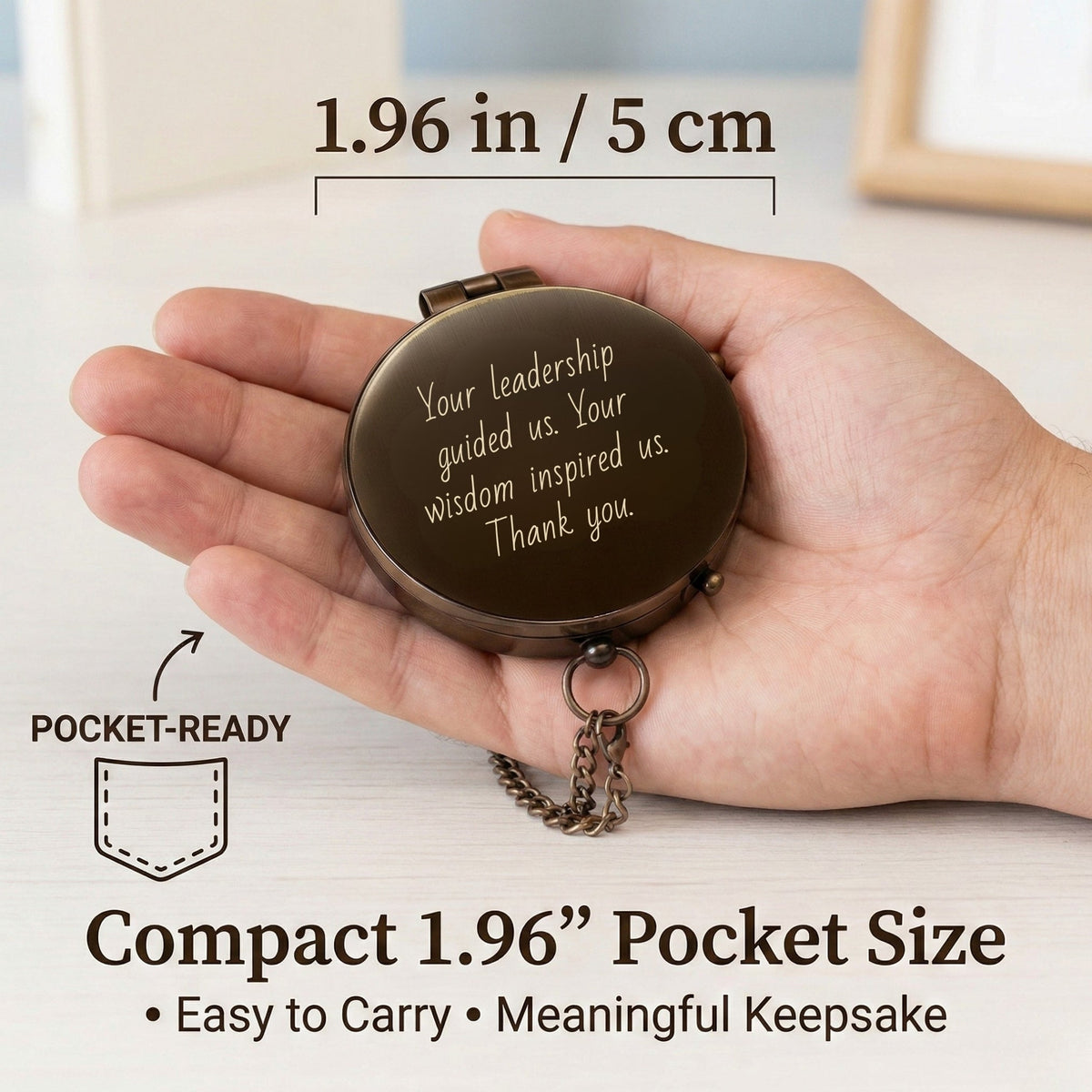 Compact pocket-sized compass held in a hand with text and measurements displayed.